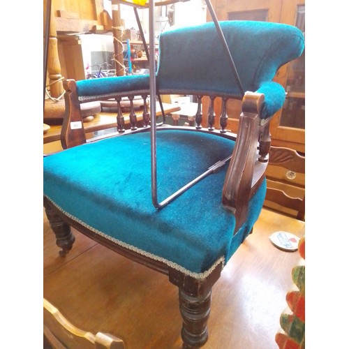 983 - A late Victorian mahogany tub chair with teal upholstery.