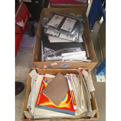 423 - Two boxes of stamp albums, covers and loose stamps.