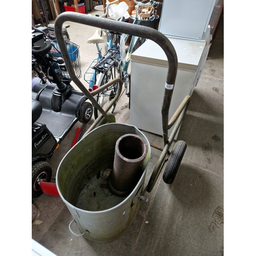 275 - A galvanised bin on a trolley together with a earthenware drain pipe.