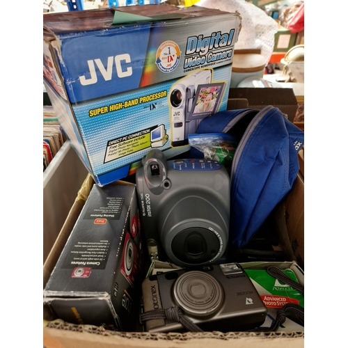 291 - A box of cameras including JVC video camera, Fuji instant camera, etc.