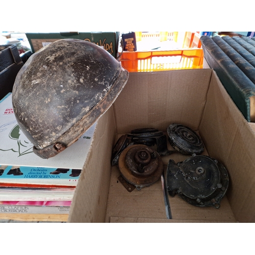 294 - A box containing vintage horns and helmet.