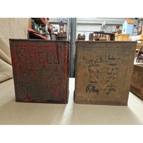 222 - Two vintage Shell oil cans in a vintage wooden box.