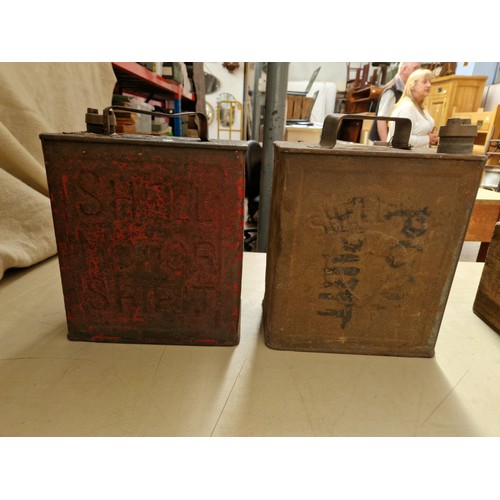 222 - Two vintage Shell oil cans in a vintage wooden box.