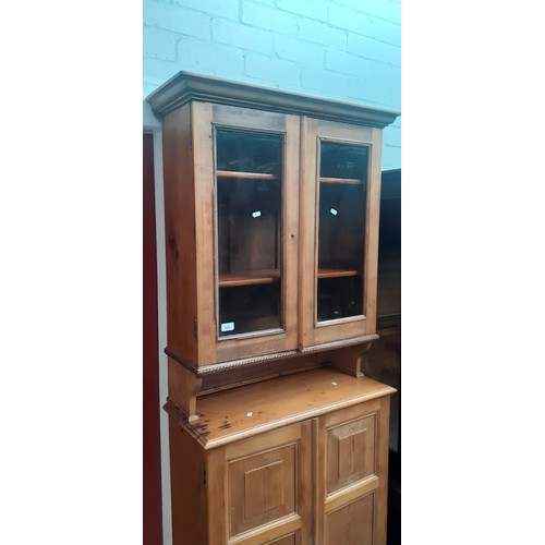 938 - A late Victorian pine secretaire cabinet bookcase, the interior fitted with drawers.