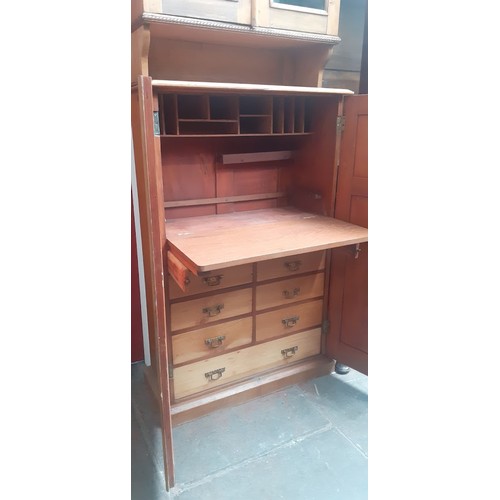 938 - A late Victorian pine secretaire cabinet bookcase, the interior fitted with drawers.