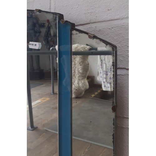 863 - A 1930s Art Deco frameless wall mirror with blue glass panels, 76.5cm x 48cm.