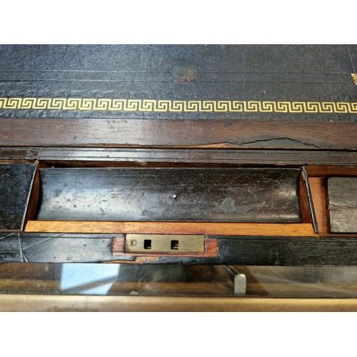 28 - An antique writing slope.