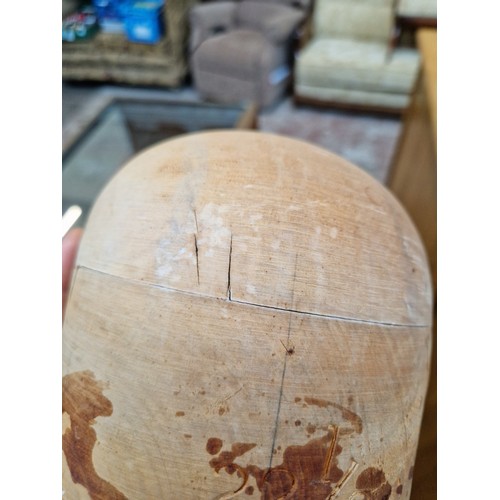 79 - A milliners wooden hat block, size 22 1/2