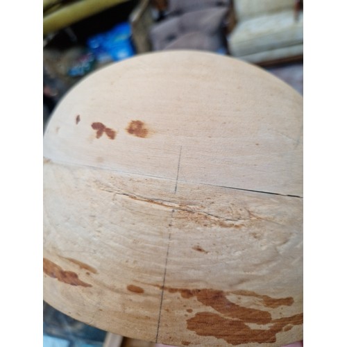 79 - A milliners wooden hat block, size 22 1/2