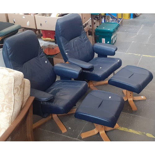 771 - A pair of navy faux leather swivel chairs with matching stools.