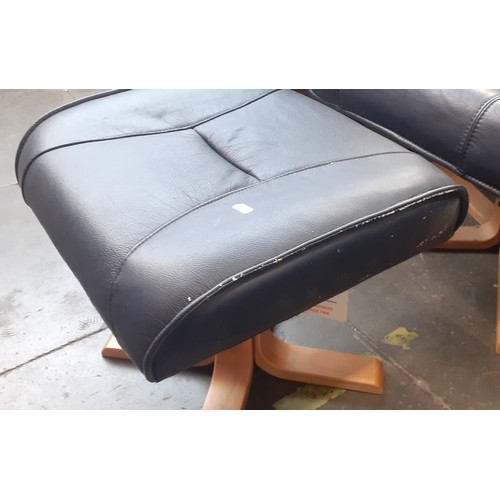 771 - A pair of navy faux leather swivel chairs with matching stools.