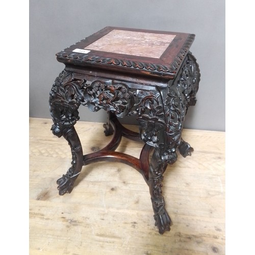 221 - A Chinese late 19th century carved marble top plant stand, height 47cm.