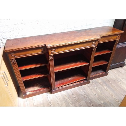 217 - A late Regency or George IV mahogany bookcase, breakfront with reeded edge, three frieze drawers, ca... 