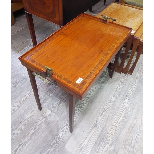 220 - A rosewood inlaid and satin wood tray table by Osterley, twin brass handles, height 60cm.