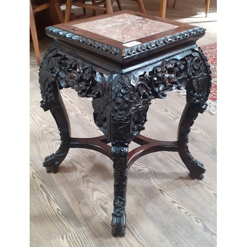 221 - A Chinese late 19th century carved marble top plant stand, height 47cm.