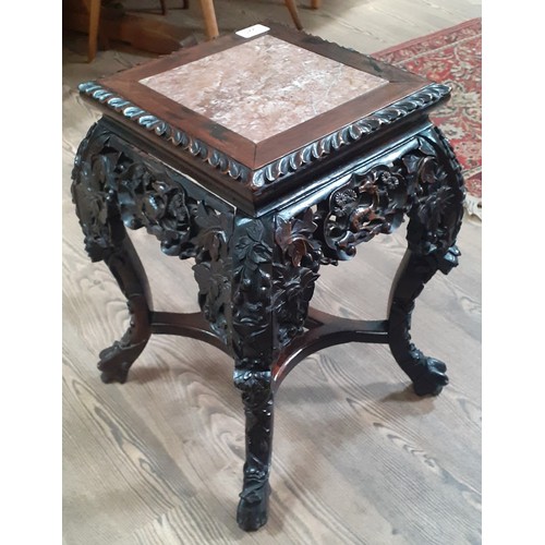 221 - A Chinese late 19th century carved marble top plant stand, height 47cm.