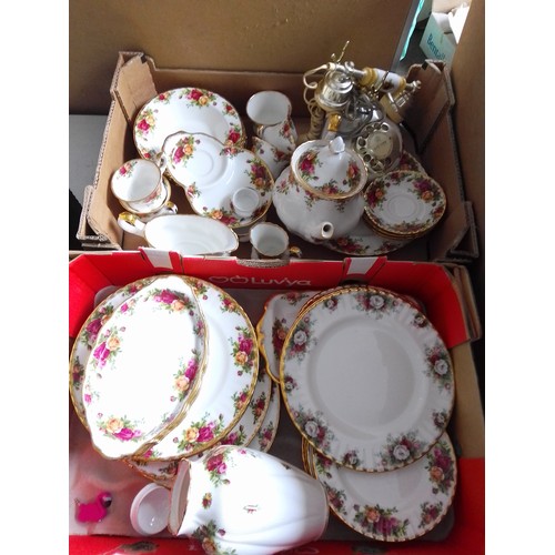 699 - 2 boxes of Royal Albert Old Country Roses, together with 2 Royal Albert Celebrations plates