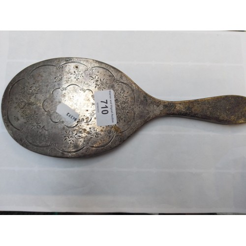 710 - A hallmarked silver hand mirror