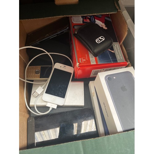 69 - A box of electrical items including 2 laptops ( AF ), various phones to include an Iphone with charg... 