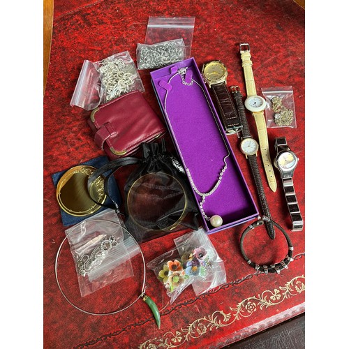 705 - A box of assorted costume jewellery including white metal, nephrite jade, fashion watches etc.