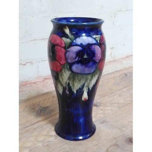 64 - A Moorcroft pottery vase, height 28cm, (chip to rim and foot).