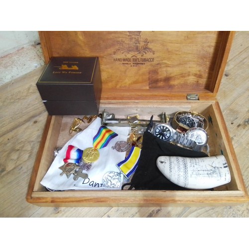 100 - A wooden box containing various items of militaria and collectables including King's Regiment silver... 