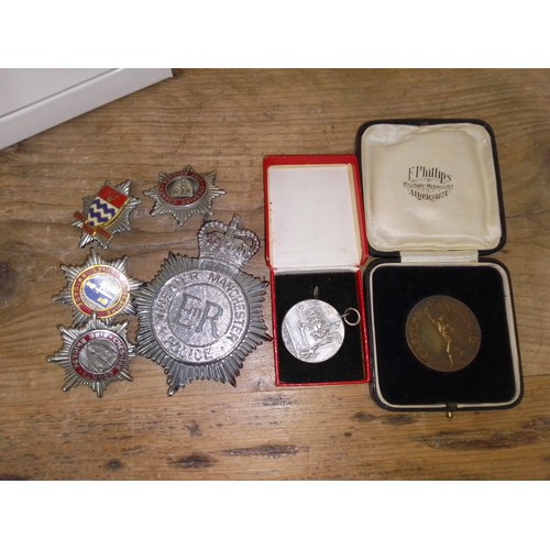 110 - A box containing five assorted badges including GMP helmet badge plus two vintage boxed military med... 