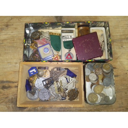 113 - Assorted military badges and assorted medallions and a tin of coins.