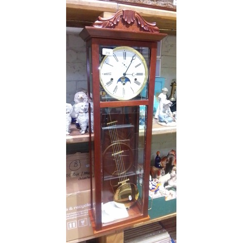 216 - A German mahogany cased chiming wall clock with moondial by Keininger, complete with weights, pendul... 