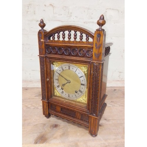 214 - A W&H oak cased architectural bracket clock, height 38cm.