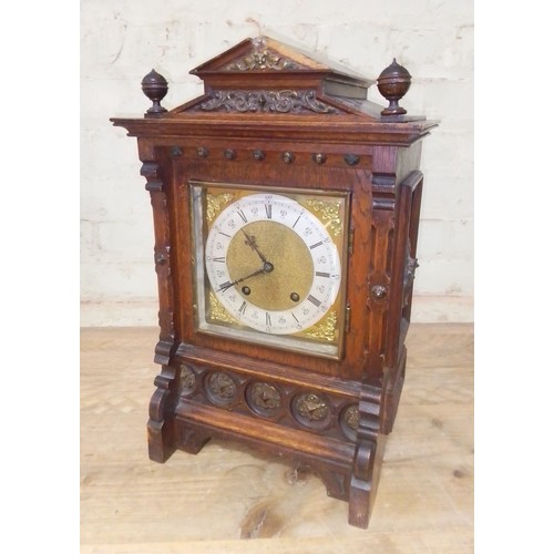 215 - A W&H oak cased architectural bracket clock, height 43cm.