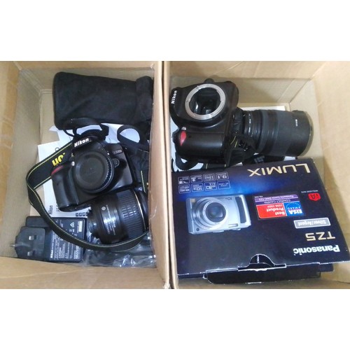 221 - Assorted cameras comprising a Nikon D3200 with two lenses, a Nikon D60 with one lens (not currently ... 