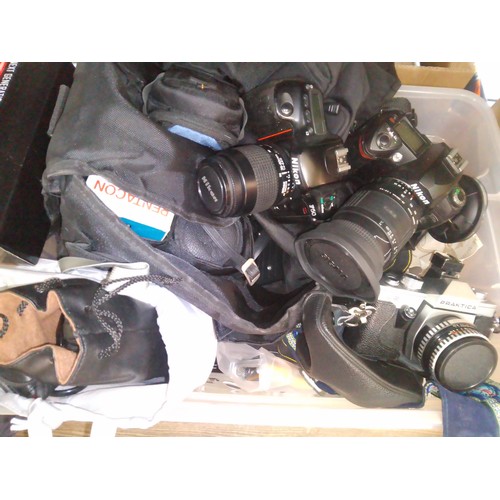 223 - A box of cameras and accessories including Nikon F50, Nikon D70s, Praktica L2, Canon Powershot G6, f... 