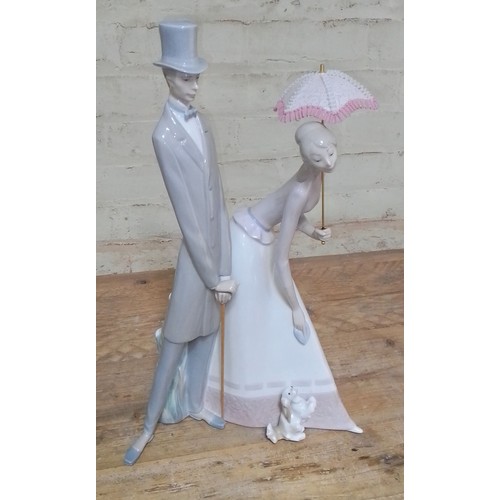 268 - A large Lladro figure group 'Couple with Parasol', number 4563, height 50.5cm.