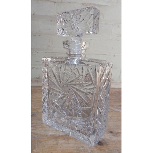 263 - A cut glass decanter of square form, height 25.5cm.