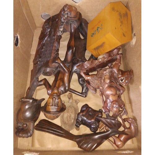 276 - A box of assorted carved wood including African and Chinese.