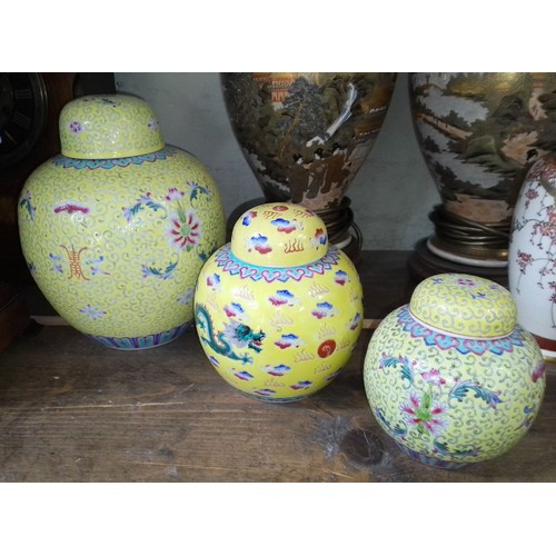 275 - A matched set of three graduated Chinese porcelain famillie juane ginger jars, 20th century.