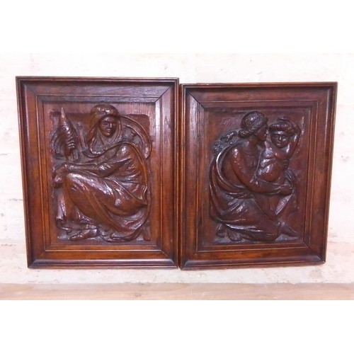 305 - A pair of carved 19th century oak panels, oak frames approx. 24cm x 30cm each.