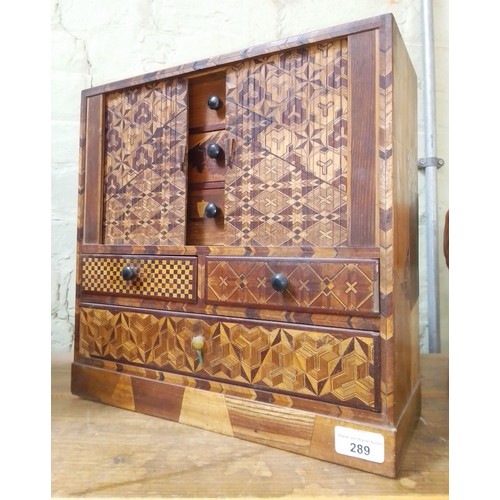 289 - A Japanese parquetry inlaid cabinet, height 36cm.