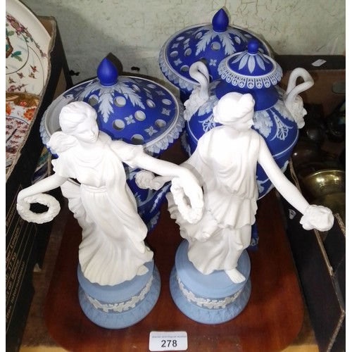 278 - Wedgwood comprising a pair of lidded urns, a pedestal vase and two Dancing Hour figures.