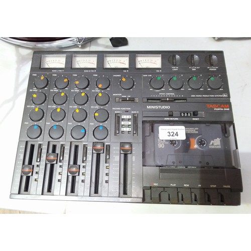 324 - A Tascam 'Porta One' ministudio four track cassette recorder.