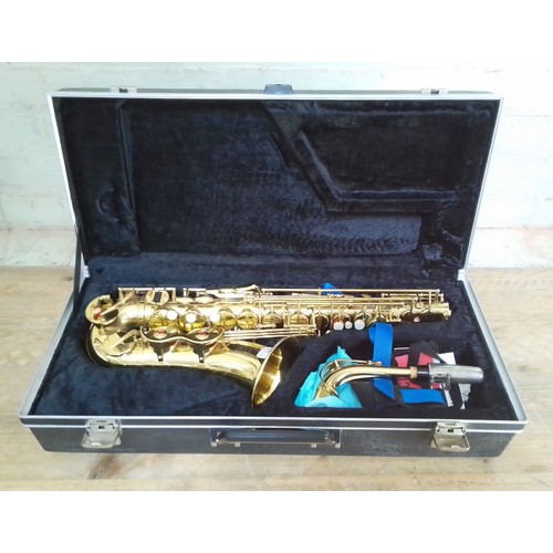 330 - An Amati Kraslice AAS 23 alto saxophone in case + stand and box of related magazines.