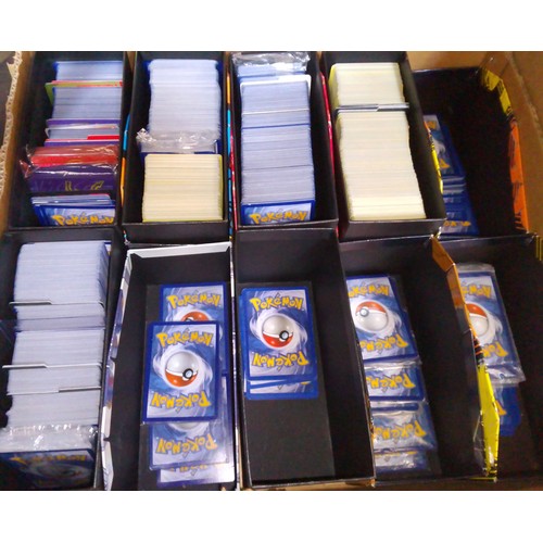 384 - A large box of Pokemon trade cards.