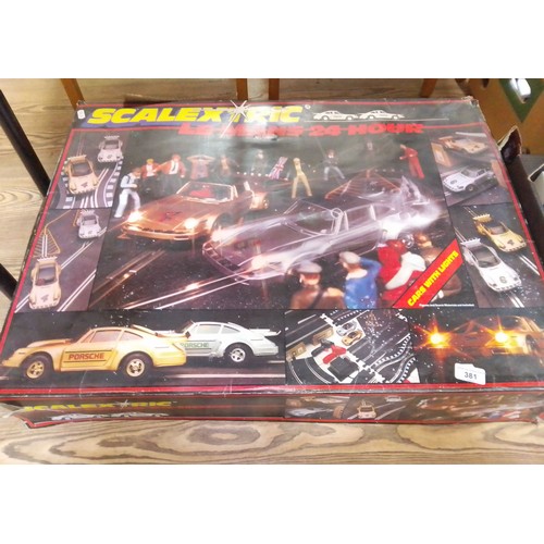 381 - A Scalextric Le Mans 24 hour boxed set with cars, etc.