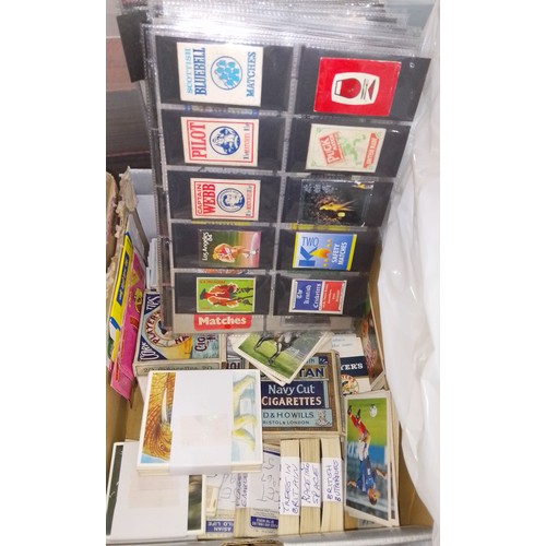 391 - A box of cigarette cards and a collection of over 600 matchbox labels.