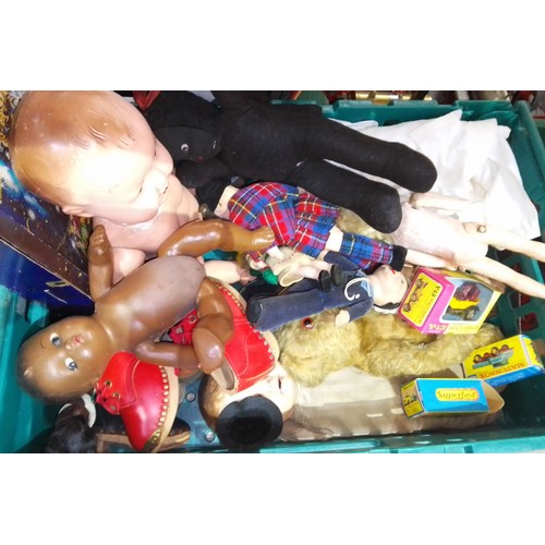 411 - A box of assorted toys and dolls including boxed Matchbox vehicles etc.