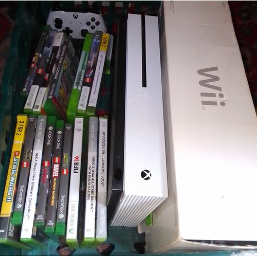 437 - An Xbox One with games together with a Wii console.