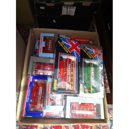 448 - A box of boxed die-cast model buses.