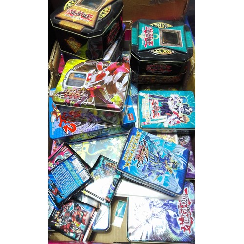 439 - A quantity of Yu-Gi-Oh cards including first editions, album, tins, etc.