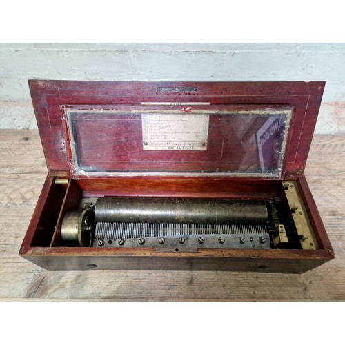 32 - A late 19th century rosewood cylinder music box, length 51.5cm.